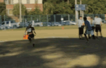 a blurred image of a group of people on a field with one wearing a jersey that says ' a ' on it