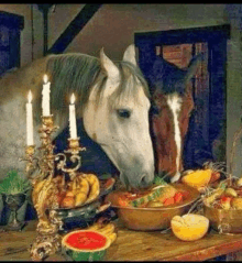 a horse is standing next to a bowl of fruit and candles .