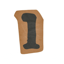 a piece of brown paper with a black number one on it