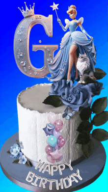 a birthday cake with cinderella and a letter g on top