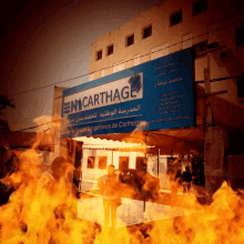 a burning building with a sign that says encarthage