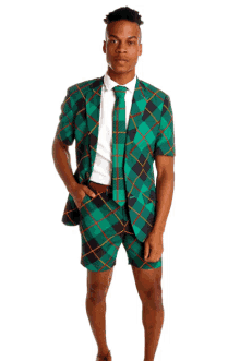 a man wearing a green plaid suit with shorts and a tie