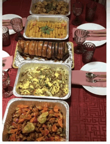 several trays of food are on a table