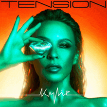 a woman is holding a diamond in front of her eye and the album cover says tension