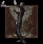 a man is dancing in front of a ghost album cover .