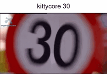 a red and white sign with the number 30 written on it