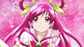 a girl with pink hair and a yellow bow on her head is smiling