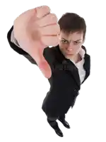 a man in a suit and white shirt is giving a thumbs down sign