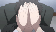 a man covering his face with his hands in a cartoon