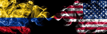 the flags of colombia and the united states are smoked together on a black background