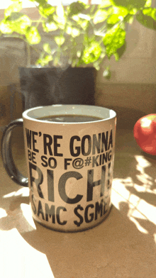 a coffee mug that says we 're gonna be so f @ # king rich