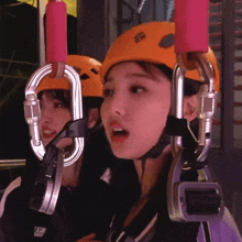 a girl wearing a helmet with the letters sg on it