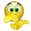 a cartoon smiley face with green eyes is pointing at the camera .