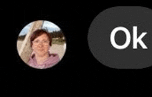 a picture of a woman in a circle next to an ok button on a black background .