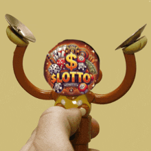 a person is holding a toy that says lotto on the front