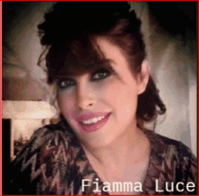 a woman named fiamma luce is smiling in a photo