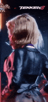 a woman in a leather jacket is standing in front of a tekken 8 banner