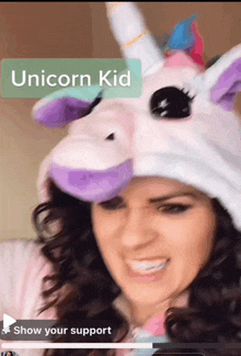 a woman wearing a unicorn costume with the words unicorn kid above her head