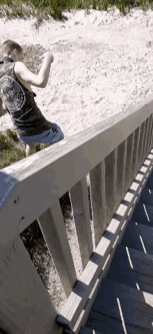 a person is laying on a wooden railing with a shirt that says ' freedom riders ' on the back