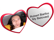 robert barbu my beloved is written on the inside of a heart shaped mirror