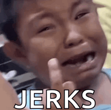a child is crying with the word jerks written on the bottom