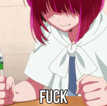 a girl with red hair is sitting at a table with the word fuck written on the bottom