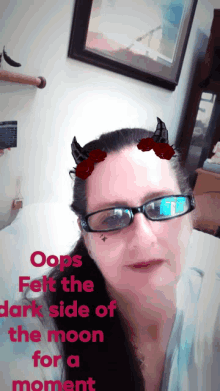 a woman wearing glasses with devil horns on her face says oops felt the dark side of the moon for a moment