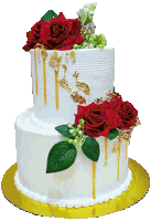 a white cake with red roses and gold leaf on it