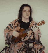 a man with long curly hair is playing a fender guitar