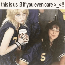 two girls are standing next to each other and one has the number 5 on her jersey