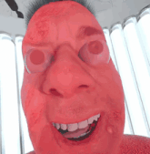 a close up of a person 's face with red eyes and white teeth
