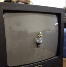 a sylvania television has a mario figure on the screen