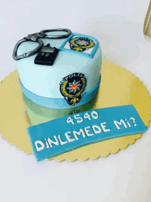 a cake with a police badge and handcuffs on top of it