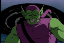 a green and purple cartoon character with a black strap around his shoulder