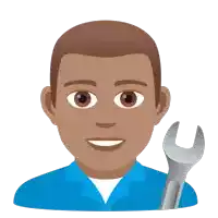 a man in a blue shirt holds a wrench