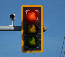 a traffic light with a camera attached to it and the words copyrighted on the bottom of it