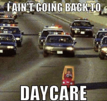 a toy car is driving down a highway next to a bunch of cars .