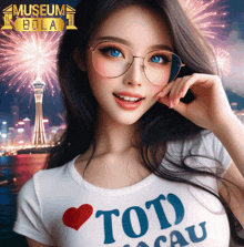 a woman wearing glasses and a shirt that says toto macau