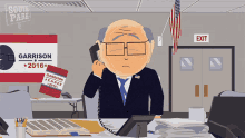 a cartoon of a man talking on a phone with a garrison 2016 sign in the background