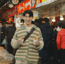 a man stands in front of a sign that says tvn e82