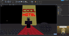 a computer screen shows a cool hotel sign in red letters