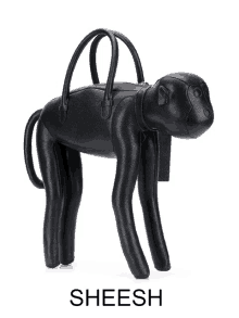 a black purse in the shape of a monkey with the word sheesh underneath it