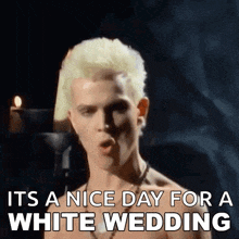 a shirtless man with blonde hair singing it 's a nice day for a white wedding