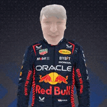 a man wearing a red bull racing jacket with a blurred head .