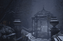 a gazebo with stairs leading to it is surrounded by snow