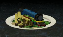 a plate of food with a blue train on top of it