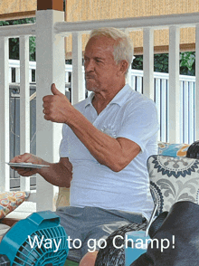 an elderly man giving a thumbs up with the words way to go champ behind him