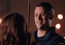 a man and a woman are looking at each other and the man is smiling with the caption dawseygifs