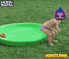 a child in a purple mask is jumping into a green pool with a fish in it ..