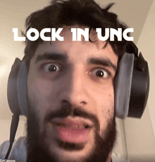 a man wearing headphones with the words lock in unc on the bottom